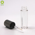 empty round plastic clear lipstick container with black cap